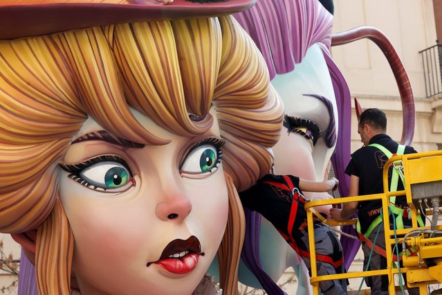 Workers prepare “Ninots” or giant figures ahead of the traditional annual Fallas festival, in Valencia, Spain, on March 15, 2024. (Photo by Eva Manez/Reuters)