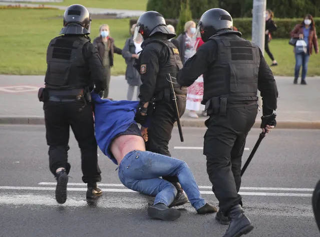 Riot police detain a protester during an opposition rally to protest the presidential inauguration in Minsk, Belarus, Wednesday, September 23, 2020. (Photo by TUT.by via AP Photo)