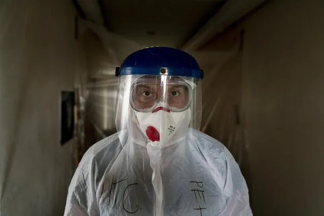 Dr. Oleh Hornostayev walks through a corridor at the hospital in Stryi, Ukraine, on Tuesday, September 29, 2020. (Photo by Evgeniy Maloletka/AP Photo)