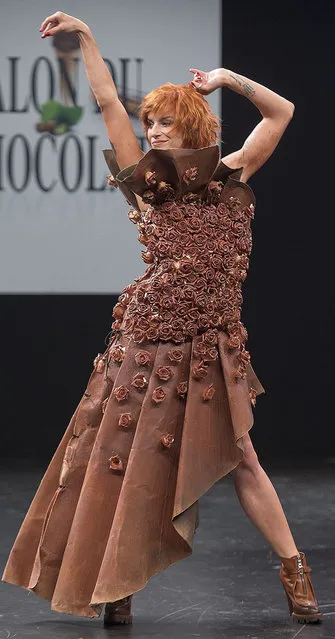 French dancer Fauve Hautot presents a chocolate studded dress during a show as part of the chocolate fair in Paris, Tuesday, October 27, 2015. (Photo by Jacques Brinon/AP Photo)