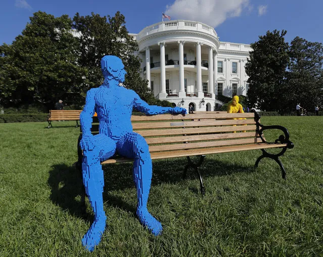 Sculptures made entirely of Lego bricks, created by contemporary artist Nathan Sawaya, are seen at the White House in Washington, Monday, October 3, 2016, part of South by South Lawn. The festival is inspired by Austin's South by Southwest, with art, film and music performances and hosted by President Barack Obama. (Photo by Pablo Martinez Monsivais/AP Photo)