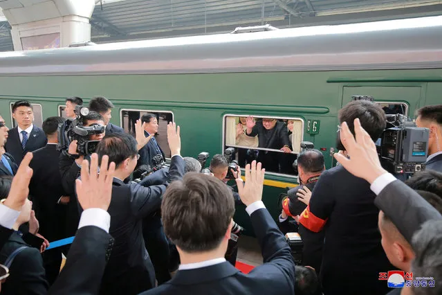 North Korean leader Kim Jong Un waves from a train, as he paid an unofficial visit to China, in this undated photo released by North Korea's Korean Central News Agency (KCNA) in Pyongyang March 28, 2018. (Photo by Reuters/KCNA)