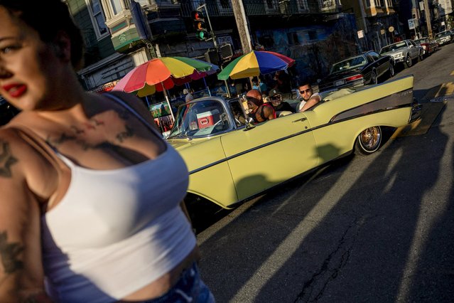 People take part in a lowrider car show celebrating lowriding culture and supporting immigration, in San Francisco, California, U.S., September 20, 2025. (Photo by Manuel Orbegozo/Reuters)