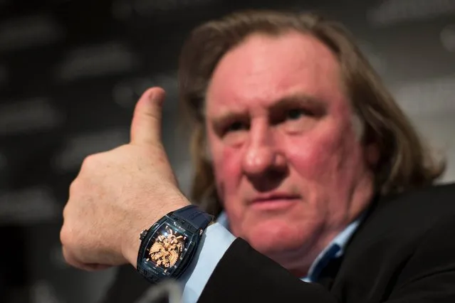 Actor Gerard Depardieu looks on during a presentation of watches by CVSTOS, a Swiss luxury watch brand from the line “Proud to be Russian” in Moscow, Russia, Wednesday, December 17, 2014. (Photo by Alexander Zemlianichenko/AP Photo)