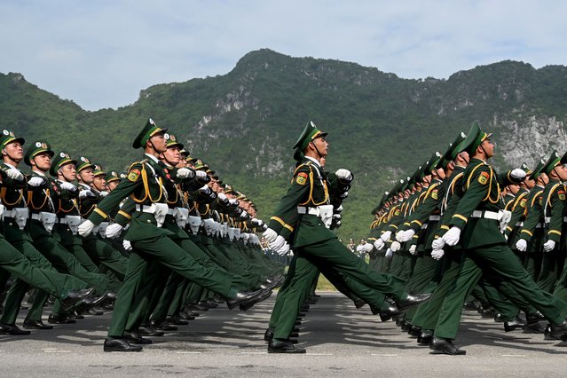 Military forces take part in a National Day parade rehearsal in Hanoi on August 13, 2025, ahead of Vietnam's 80th National Day on September 2. (Photo by Nhac Nguyen/AFP Photo)
