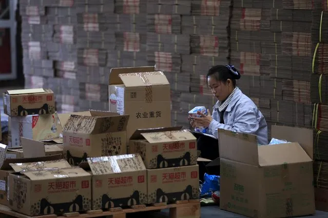An employee works at a Tmall logistic centre in Suzhou, Jiangsu province, China, October 28, 2015. (Photo by Jason Lee/Reuters)
