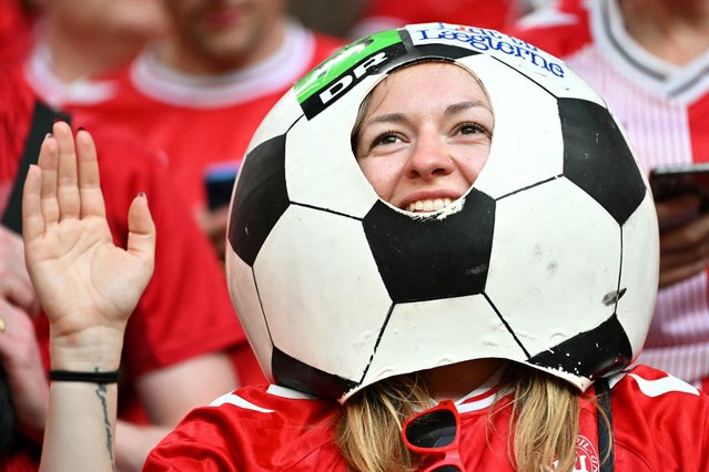 A Denmark supporter cheers prior to the  UEFA Euro 2024 Group C football match between Denmark and Serbia at the Munich Football Arena in Munich on June 25, 2024. (Photo by Miguel Medina/AFP Photo)