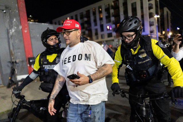 Law enforcement officers remove a counter-protester outside the ICE headquarters in Portland, Oregon, U.S., October 5, 2025. (Photo by Carlos Barria/Reuters)