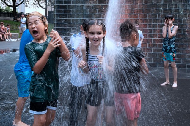 People cool off at Crown Fountain in Millennium Park as temperatures reached a record high of 97 degrees Fahrenheit on June 17, 2024 in Chicago, Illinois. Temperatures in the city are expected to reach highs in the 90s for the remainder of the week. (Photo by Scott Olson/Getty Images)