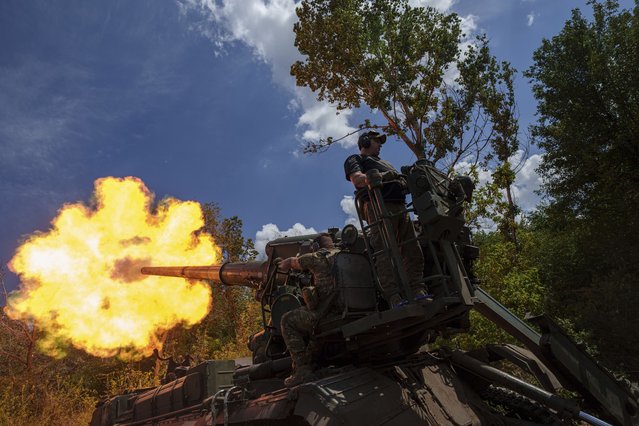 Ukrainian soldiers, of 43rd artillery brigade, fire by 2s7 self-propelled howitzer towards Russian positions at the frontline in Donetsk region, Ukraine, Monday, June 10, 2024. (Photo by Evgeniy Maloletka/AP Photo)