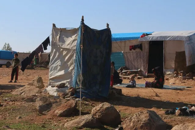 An outdoor toilet is seen outside tents at a makeshift refugee camp for internally displaced Syrians in Sinjar town, in Idlib province, Syria November 20, 2015. (Photo by Ammar Abdullah/Reuters)