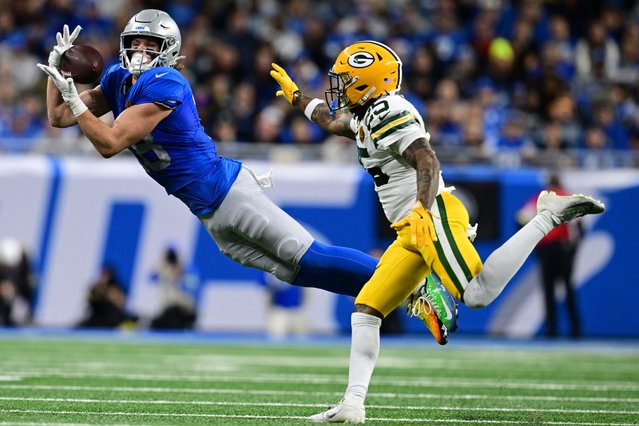 Detroit Lions wide receiver Isaac TeSlaa catches a pass while being covered by Green Bay Packers cornerback Keisean Nixon during the second half of an NFL football game in Detroit, Thursday, Nov. 27, 2025. (Photo by AP Photo)