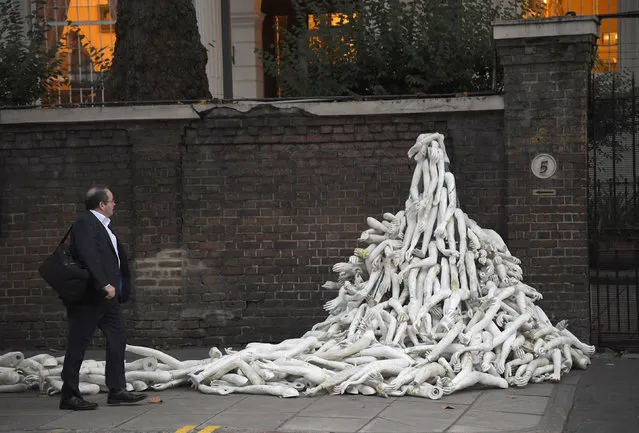 Piles on mannequin limbs are seen outside the Russia's embassy in London as part of a protest against military action in Syria, November 3, 2016. (Photo by Toby Melville/Reuters)
