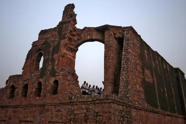 Muslims offer prayers during the holy month of Ramadan at the ruins of the Feroz Shah Kotla mosque in New Delhi, India, May 31, 2018. (Photo by Amit Dave/Reuters)