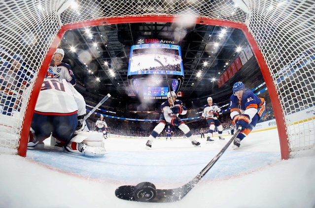 The New York Islanders’ Simon Holmström scores a goal past Columbus goalie Elvis Merzļikins during an NHL game in Elmont, New York, on Sunday, November 2, 2025. It came late in the third period, lifting the Islanders to a 3-2 victory. (Photo by Bruce Bennett/Getty Images)