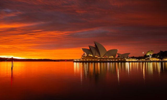 This photo taken on August 27, 2025 shows morning glow at the Opera House in Sydney, Australia. (Photo by Xinhua News Agency/Rex Features/Shutterstock)