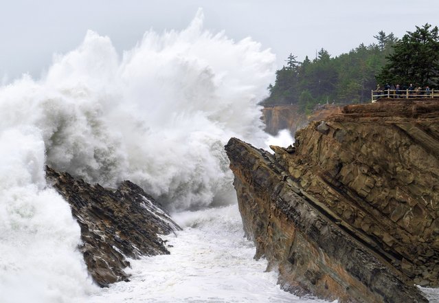 A group of photographers gather on an overlook as massive waves crash ashore at Shore Acres State Park near Charleston on the southern Oregon coast on November 6, 2025. The dramatic surf was fueled by unusually high king tides – the year's highest astronomical tides, which occur when the sun and moon align to amplify gravitational pull on the oceans. The National Weather Service issued a High Surf Advisory for the area as waves pounded the cliffs and sent spray soaring into the air. (Photo by Robin Loznak/ZUMA Press Wire/Rex Features/Shutterstock)