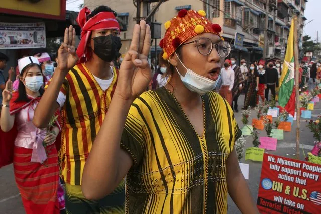 Anti-coup protesters shout slogans during a rally in Yangon, Myanmar on Thursday March 25, 2021. Protesters against last month’s military takeover in Myanmar returned to the streets in large numbers Thursday, a day after staging a “silence strike” in which people were urged to stay home and businesses to close for the day. (Photo by AP Photo/Stringer)