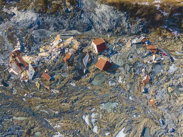 An image taken with a drone taken on 08 March 2021 shows an aerial view of the area where a large landslide destroyed several homes at Ask in Gjerdrum, Norway, on 30 December 2020. Nine people were found dead due to the incident and one is still missing. Around 600 residents who were evacuated after the landslide were allowed to return to their homes on 03 February 2021. (Photo by Stian Lysberg Solum/EPA/EFE)