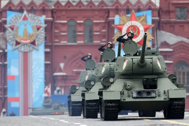 Historical T-34 tanks move through Red Square during the Victory Day military parade in Moscow on May 9, 2021. Russia celebrates the 76th anniversary of the victory over Nazi Germany during World War II. (Photo by Dimitar Dilkoff/AFP Photo)