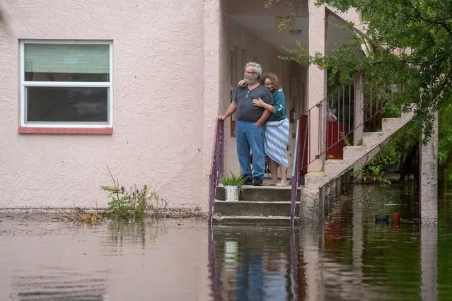 Ken and Tina Kruse stand next to their apartment after the area flooded from Hurricane Idalia in Tarpon Springs, Florida, U.S. August 30, 2023. (Photo by Greg Lovett/USA Today Network via Reuters)