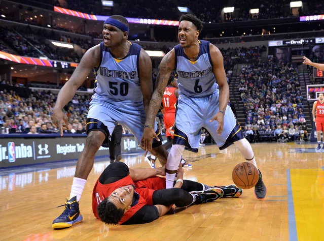 Memphis Grizzlies forward Zach Randolph (50), and guard Mario Chalmers (6), stand over New Orleans Pelicans forward Anthony Davis, bottom, as they wait for a referee call on possession of the ball in the first half of an NBA basketball game Monday, January 18, 2016, in Memphis, Tenn. (Photo by Brandon Dill/AP Photo)