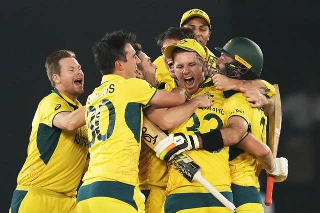 Australia players celebrate after winning the ICC Men's Cricket World Cup final match against India in Ahmedabad, India, Sunday, November 19, 2023. (Photo by Rafiq Maqbool/AP Photo)