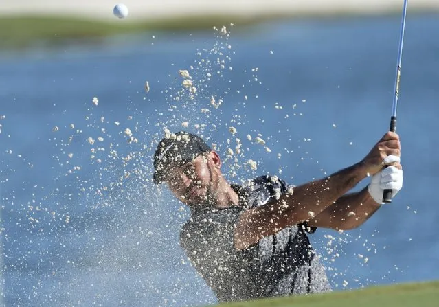 Australia's Jason Day hits the ball out of the 9th hole bunker during the final round of the Hero World Challenge PGA Tour at the Albany Golf Club in New Providence, Bahamas, Sunday, December 3, 2023. (Phoot by Fernando Llano/AP Photo)