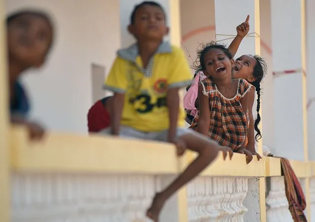 Children play on April 13, 2015 at a refugee boarding facility run by the UN High Commission for Refugees at Obock, a small port town in Djibouti located on the northern shore of the Gulf of Tadjoura, where it opens out into the Gulf of Aden. (Photo by Tony Karumba/AFP Photo)