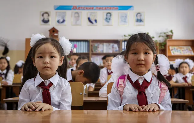 Students sit in a classroom in Bishkek, Kyrgyzstan on September 16, 2021. Schools in Kyrgyzstan reopened on September 15. (Photo by Gulzhan Turdubaeva/Radio Free Europe/Radio Liberty)
