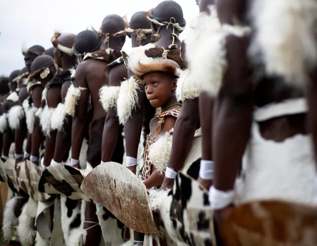 A young dancer looks on as he waits to perform during the annual Sishaya Ingoma dance competition in Durban, South Africa, March 21, 2019. (Photo by Rogan Ward/Reuters)