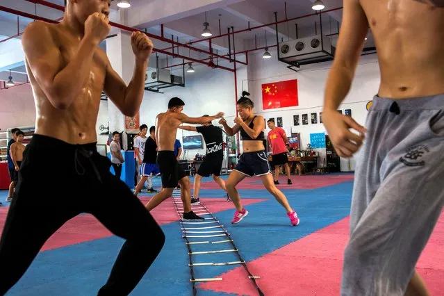 Huang Wensi in action during her final training session in Ningbo, Zhejiang province, China, before she heads to Taiwan for her Asia Female Continental Super Flyweight Championship match, September 23, 2018. Huang is one of a small but growing number of women in China to embrace professional boxing, relishing its intense nature despite traditional stereotypes that steer women away from such activities. “A women is not just limited to being a wife or mother in the house”, she said. (Photo by Yue Wu/Reuters)