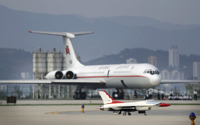 In this September 25, 2016, file photo, a remote-controlled F-16 fighter jet lands in front of an Air Koryo commercial airplane at the Kalma Airport after a flight demonstration in Wonsan, North Korea. With U.S. President Donald Trump and North Korean leader Kim Jong Un descending on Hanoi for their second summit, there has been a persistent suggestion that Kim will look around at the relative prosperity of his Vietnamese hosts – who are certainly no strangers to U.S. hostility – and think that he, too, should open up his country to more foreign investment and trade. (Photo by Wong Maye-E/AP Photo)