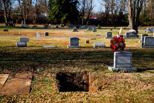 A grave is seen after being dug for Ollie Reeves, 80, who died in her home when a devastating outbreak of tornadoes ripped through several U.S. states in Mayfield, Kentucky, U.S. December 20, 2021. (Photo by Cheney Orr/Reuters)