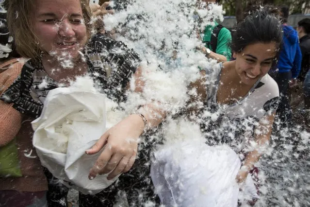 People take part in the International Pillow Fight Day at Hong Kong's financial Central district April 5, 2014. (Photo by Tyrone Siu/Reuters)