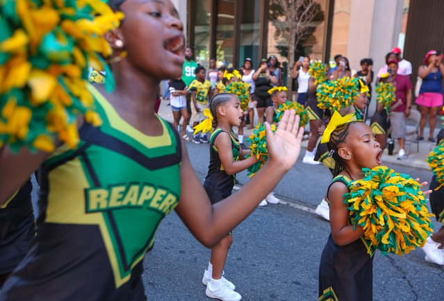 Members of the Tri-City Reapers cheerleaders perform during the Delaware Juneteenth Association parade along King Street in Wilmington preceding the Juneteenth Festival on Saturday, June 15, 2024. (Photo by William Bretzger/Delaware News Journal)