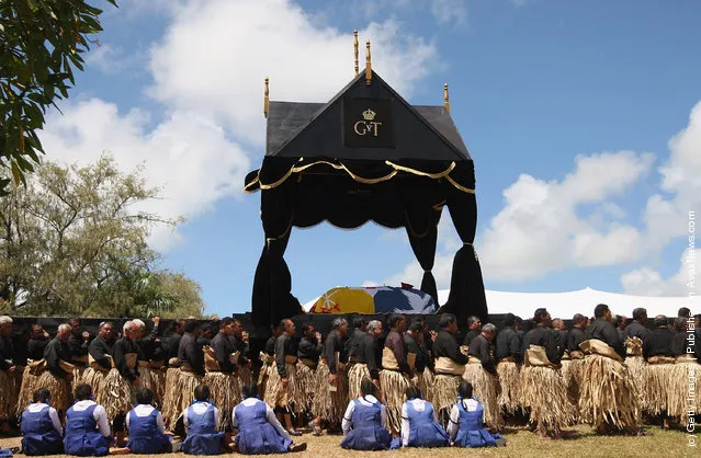 The Royal casket of King George Tupou V is carried towards the Royal Tombs during the State Funeral held for King George Tupou V at Mala'ekula