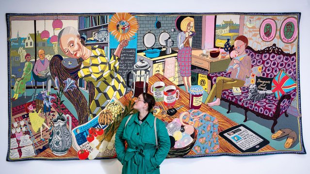 A staff member with “The Annunciation of the Virgin Deal”, 2012, at a preview of “Grayson Perry: The Vanity of Small Differences”, 2012, a new exhibition at Pitzhanger Manor & Gallery in Ealing, west London on July 9, 2024. (Photo by Stephen Chung/Alamy Live News)