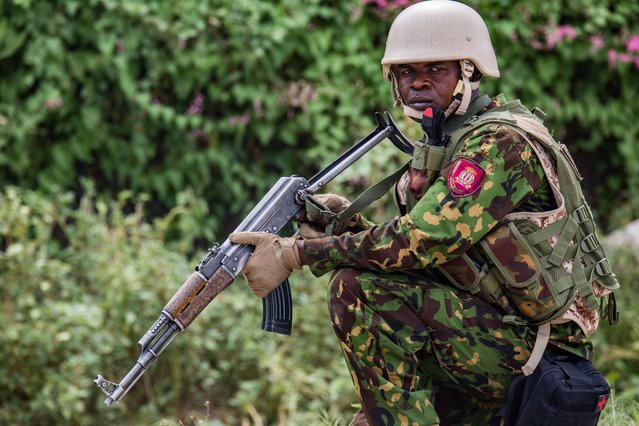 A Kenyan police officer, part of the first contingent of the Multinational Security Support Mission (MMAS), guards the area around the US Embassy in Port-au-Prince, Haiti, 05 July 2024. The first contingent of Kenyan police arrived in Haiti on 25 June 2024 to assist the Caribbean country in their fight against gangs. (Photo by Mentor David Lorens/EPA/EFE)