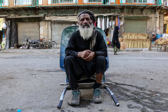 A laborer who works on daily wages waits for customers on a roadside in Kabul, Afghanistan, 10 September 2024. The International Organization for Migration (IOM) has identified Afghanistan as one of the ten most vulnerable countries to climate change, highlighting that since 2022, climate change has become the primary cause of internal displacement, surpassing war. The report notes that droughts and severe floods have impacted over half of Afghanistan's population, leading to water scarcity, land degradation, food insecurity, and significant economic challenges. The United Nations refugee agency reports that the number of internally displaced persons in Afghanistan has exceeded three million, illustrating the dire consequences of climate-related disasters in the region. (Photo by Samiullah Popal/EPA/EFE)