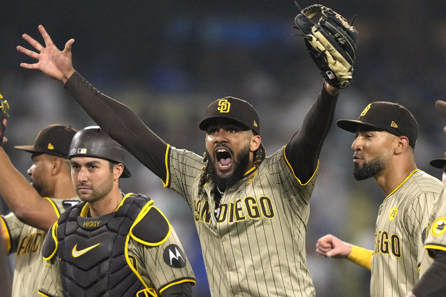 San Diego Padres' Fernando Tatis Jr., center, celebrates with teammates after the Padres clinched a playoff spot with a triple play to end their baseball game against the Los Angeles Dodgers, Tuesday, September 24, 2024, in Los Angeles. (Photo by Mark J. Terrill/AP Photo)