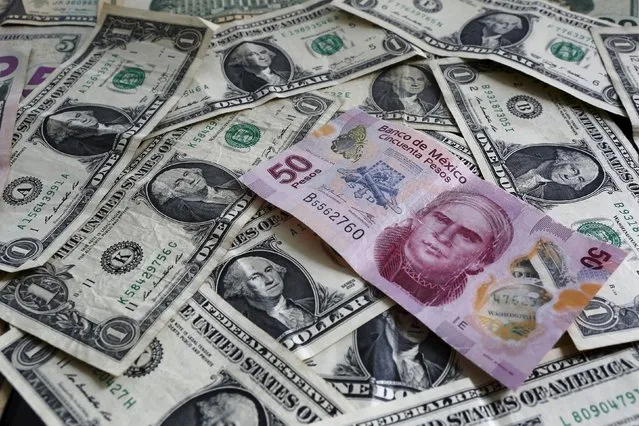 A picture illustration shows Mexican pesos and U.S. dollars banknotes in Mexico City July 6, 2015. Latin American currencies weakened after Greece overwhelmingly rejected a bailout offer from creditors, though moves were muted as investors bet the fallout would be limited. Nearly every currency dropped against the dollar. (Photo by Edgard Garrido/Reuters)