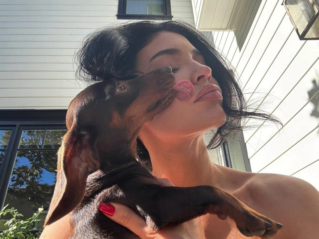 Kylie Jenner gets some kisses from her pooch in the last decade of October 2024. (Photo by kyliejenner/Instagram)