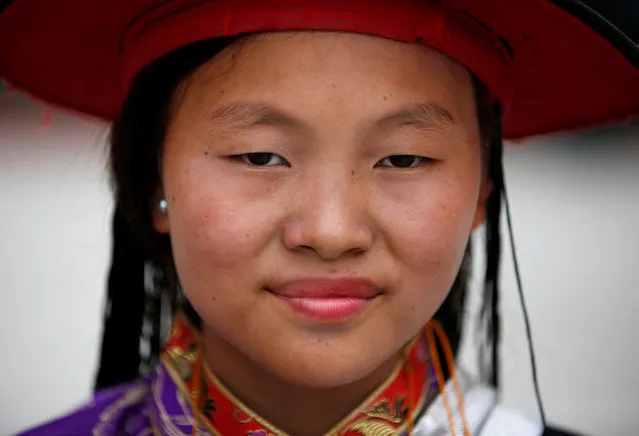 A Tibetan girl in a traditional attire takes part in a function organized to mark the birthday celebration of Dalai Lama in Kathmandu, Nepal, July 6, 2016. (Photo by Navesh Chitrakar/Reuters)