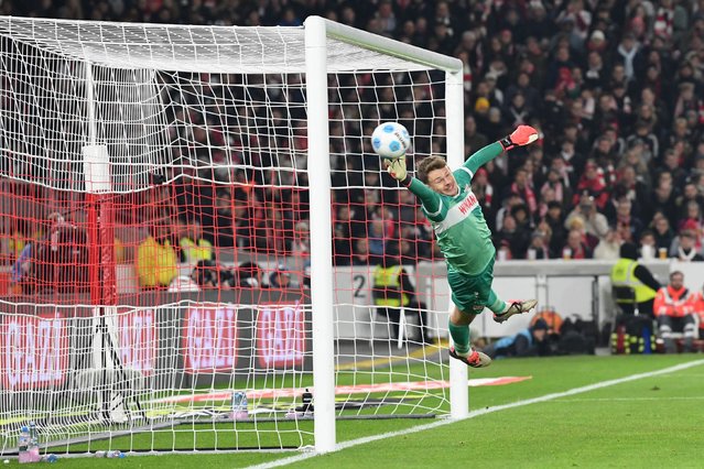 Stuttgart's German goalkeeper #33 Alexander Nuebel reaches but can't stop the ball of the 0-3 goal during the German first division Bundesliga football match VfB Stuttgart vs Eintracht Frankfurt in Stuttgart, southwestern Germany on November 10, 2024. (Photo by Thomas Kienzle/AFP Photo)
