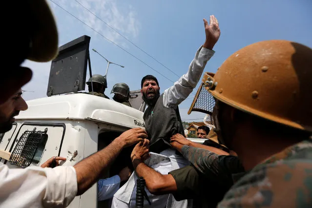 A supporter of Syed Ali Shah Geelani, chairman of the hardline Hurriyat (Freedom) Conference group, is detained by Indian police during a protest in Srinagar against the recent killings in Kashmir, July 13, 2016. (Photo by Danish Ismail/Reuters)