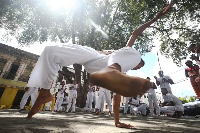 Teens perform capoeira during the Festival of the Good Death on August 17, 2014 in Cachoeira, Brazil. (Photo by Mario Tama/Getty Images)