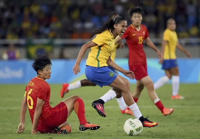 Soccer, Preliminary, Women's First Round, Group E Brazil vs China, Olympic Stadium in Rio de Janeiro, Brazil on August 3, 2016. Andressa Alves (BRA) of Brazil is fouled. (Photo by Gonzalo Fuentes/Reuters)