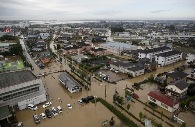 A residential area flooded by the Kinugawa river, caused by typhoon Etau, is seen in Joso, Ibaraki prefecture, Japan, September 11, 2015. (Photo by Issei Kato/Reuters)