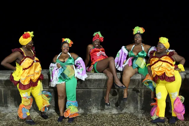 Revellers react to the camera on Havana's Malecon seafront before performing at a carnival parade, Cuba, August 12, 2016. (Photo by Alexandre Meneghini/Reuters)